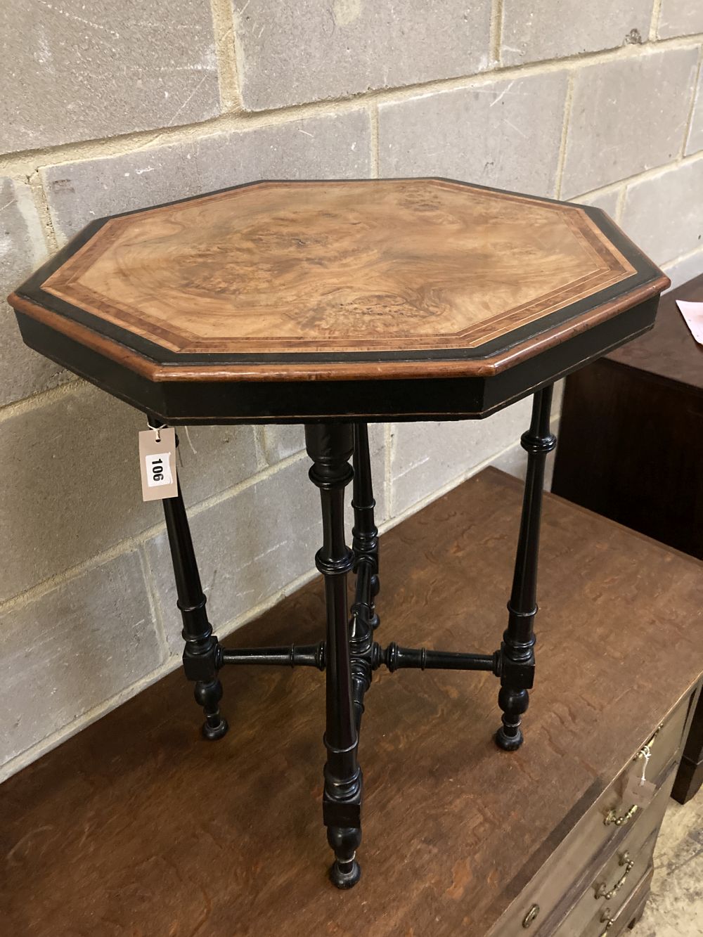 A late Victorian amboyna banded octagonal ebonised and walnut occasional table, width 49cm, depth 49cm, height 64cm